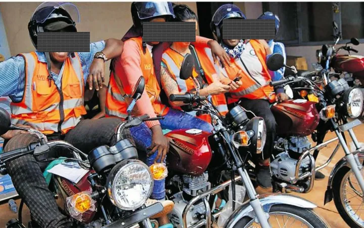 Motorcycle riders wearing helmets and reflective vests